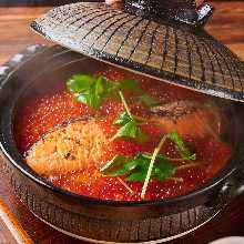 Salmon salmon roe cooked in an earthenware pot