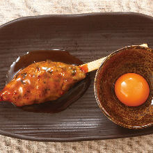 Meatballs served with egg yolk