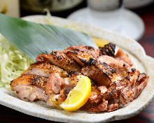 Grilled locally raised chicken thigh with rock salt