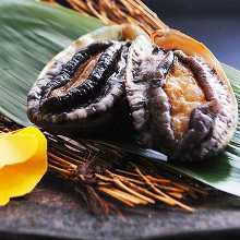 Grilled live abalone