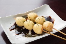 Fried quail egg skewer