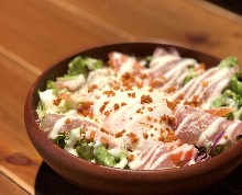 Caesar salad with soft-boiled egg and prosciutto