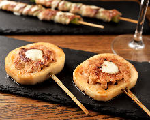 Grilled meat-stuffed lotus root skewer