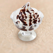 Soft serve ice cream with chocolate sauce
