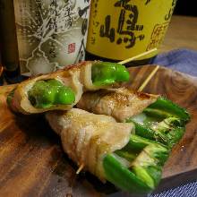 Pork wrapped green pepper and cheese skewer