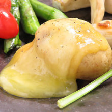 Vegetables topped with raclette cheese