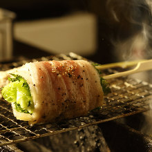 Grilled pork wrapped lettuce skewer