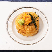 Grilled rice ball topped with sea urchin