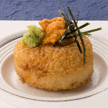 Grilled rice ball topped with sea urchin