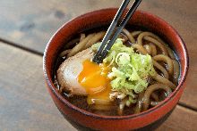 Udon stewed in miso sauce with a soft-boiled egg