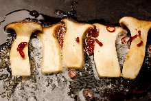 Grilled eringi mushrooms with butter