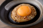 Meatballs served with egg yolk