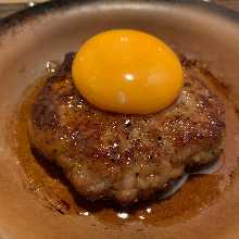Meatballs served with egg yolk