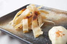 Charcoal-seared ray fin