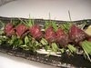 Wagyu beef roasted and wrapped with green onion sprouts