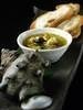 Turban shell with escargot sauce served with baguette