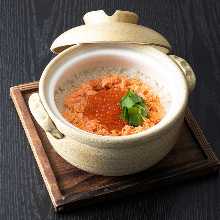 Salmon and salmon roe takikomi gohan (mixed rice) in an earthenware pot