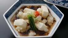 Deep-fried rice cake in broth