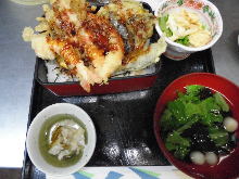 Tempura served over rice in a lacquered box