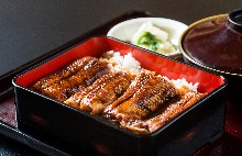 Eel served over rice in a lacquered box