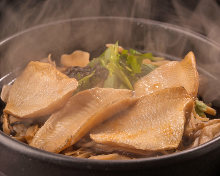 Rosy seabass and salted seaweed takikomi gohan (mixed rice) in an earthenware pot