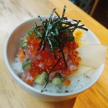 Salmon roe, salmon, and negitoro (tuna paste with green onion) rice bowl