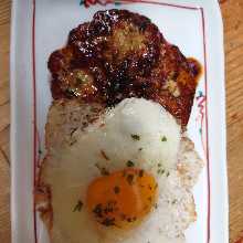 Meatballs served with egg yolk