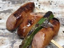 Grilled wiener sausage and bacon skewer