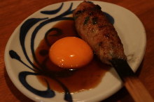 Meatballs served with egg yolk