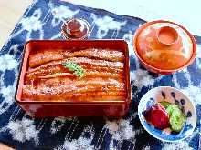 Extra premium eel served over rice in a lacquered box