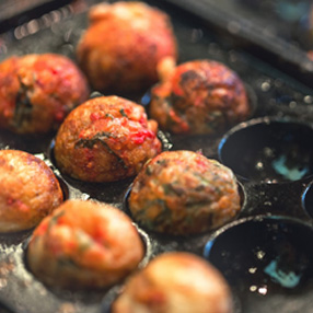 Takoyaki balls in a paper tray