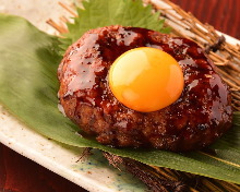 Meatballs served with egg yolk