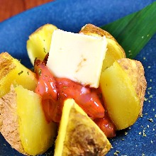 Steamed potato topped with salted squid entrails and butter