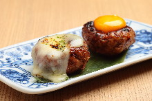 Meatballs served with egg yolk