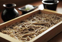 Buckwheat noodles served on a bamboo strainer