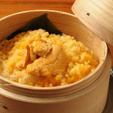 Steamed rice with toppings in wooden steamer