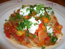 Pasta with tomato sauce, mozzarella, and basil