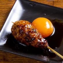 Meatballs served with egg yolk