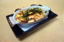 그 외 그라탱, 도리아 그 외 그라탱, 도리아